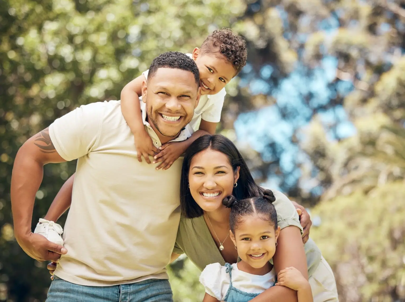 Shot of a young family happily bonding together outside