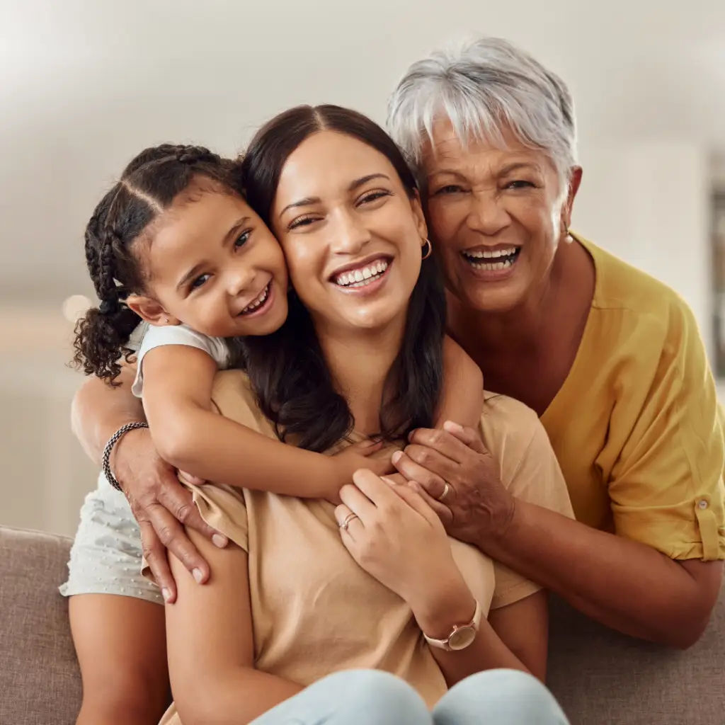 Smiling three generations of daughter, mother, and grandmother.